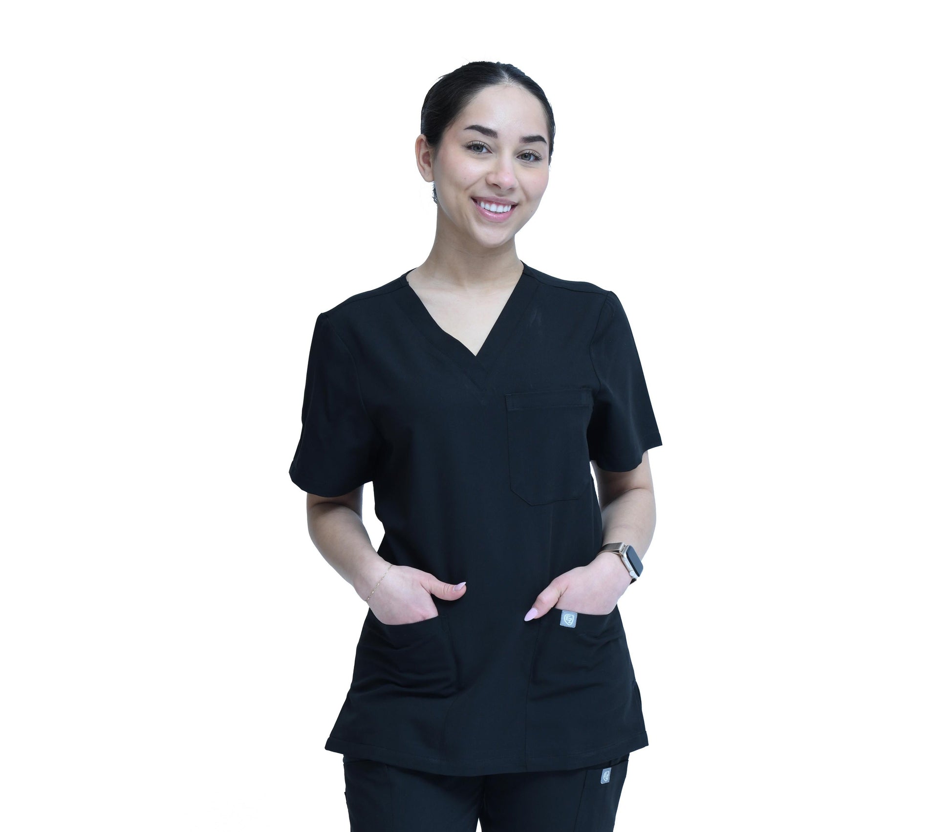 Person wearing a black scrub set on a white background